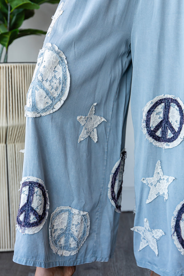 WASHED SMOCKED PEACE AND STAR PATCHWORK PANTS