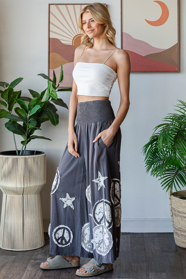 WASHED SMOCKED PEACE AND STAR PATCHWORK PANTS