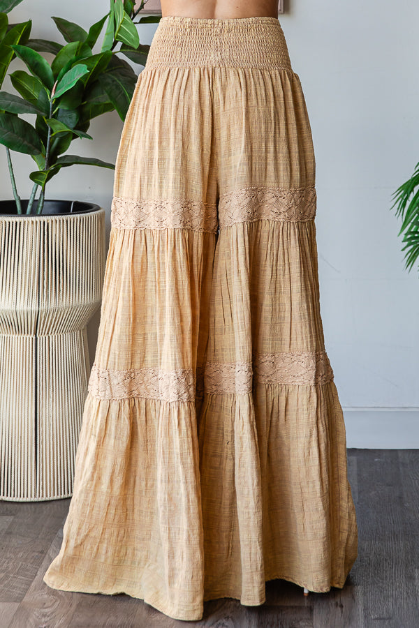 WASHED SMOCKED WAIST TIERED WIDE LEG FLARE PANTS