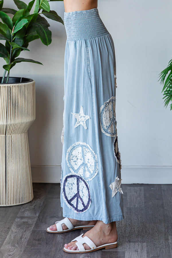 WASHED SMOCKED PEACE AND STAR PATCHWORK PANTS
